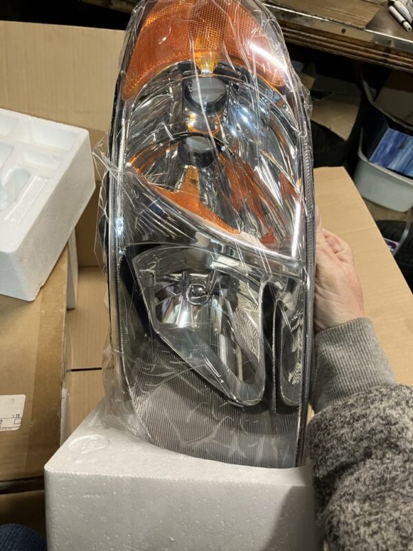 headlights, 2001-2007 Dodge Caravan, pair, new in box, old stock